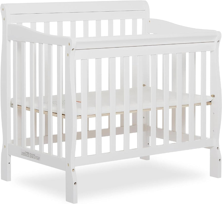 Aden 4-in-1 Convertible Mini Crib In White, Greenguard Gold Certified - $85
