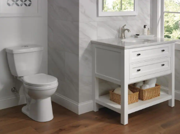 Delta Foundations 2-piece 1.1 GPF/1.6 GPF Dual Flush Round Toilet - $95